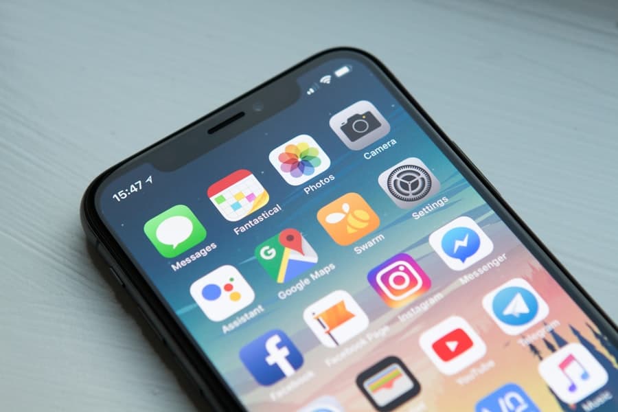 Person tracking insurance claim status on their phone